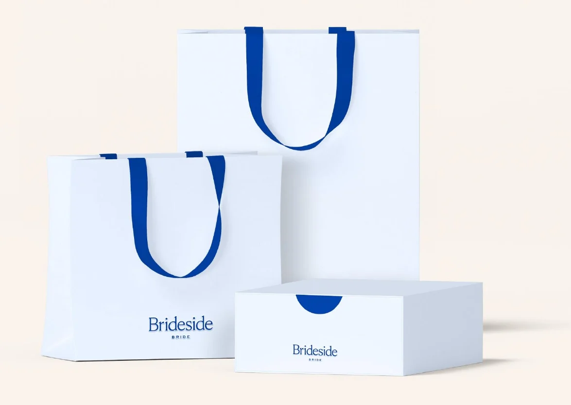 White Brideside Bride shopping bags with cobalt ribbon