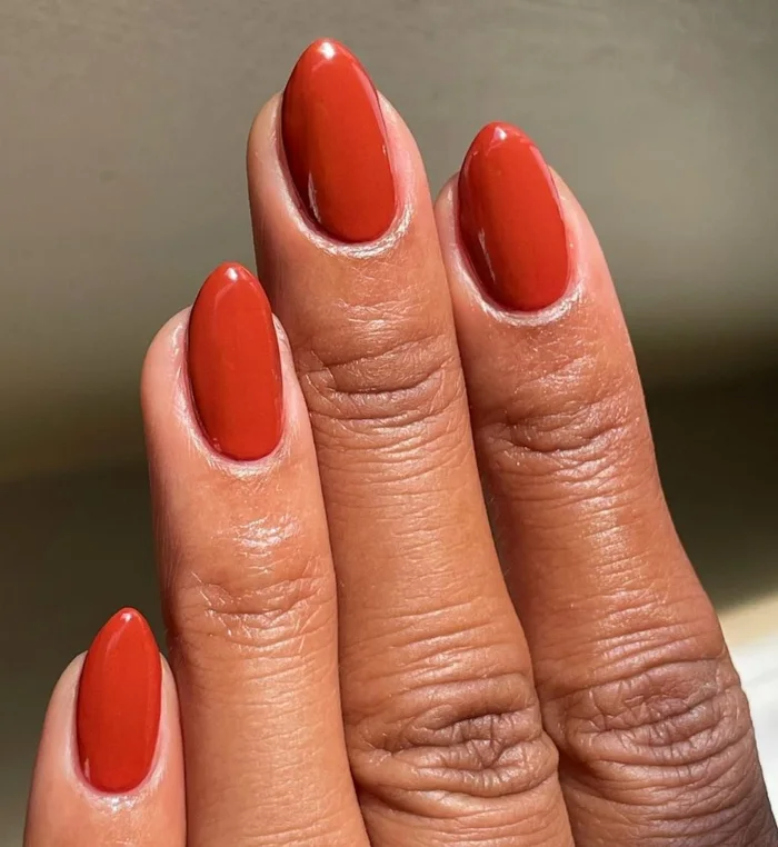 Brick-red almond manicure