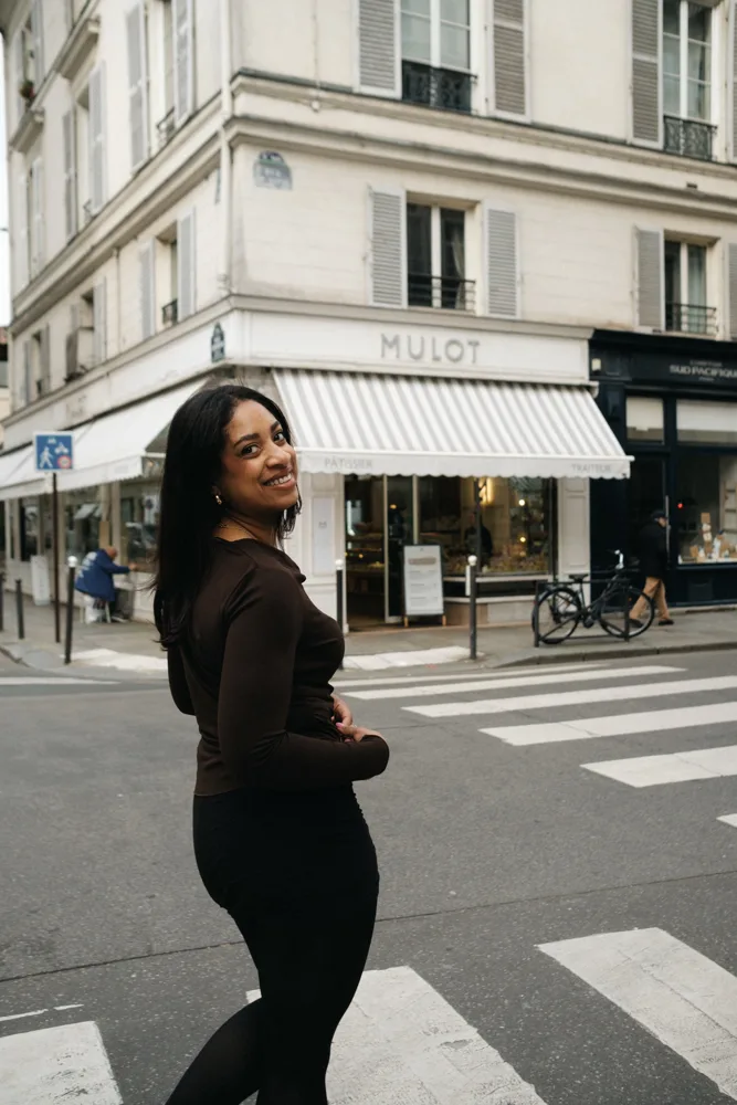 Whitney smiling outside the Mulot patisserie in Paris